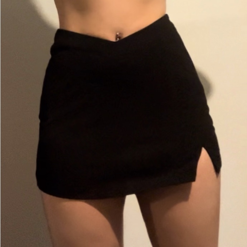 Asymmetrical crossover mini skirt. Zipper is sticky, but works.